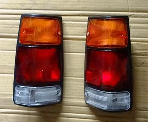ISUZU OPEL CAMPO UTE MODEL 1988 93 96 TAIL LIGHTS PAIR LH RH BLACK FRAME NEW - Picture 1 of 6