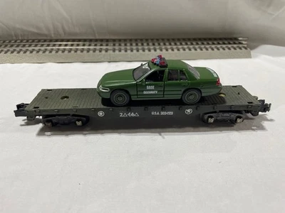 American flyer S gauge flatcar with a BASE SECURITY CAR - Image 1 of 4