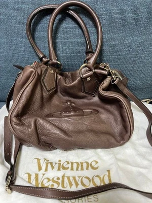 Сумка наплечная Vivienne Westwood коричневая кожаная двусторонняя Boston 30x25x15 см #EK ZEA - Изображение 1 из 4
