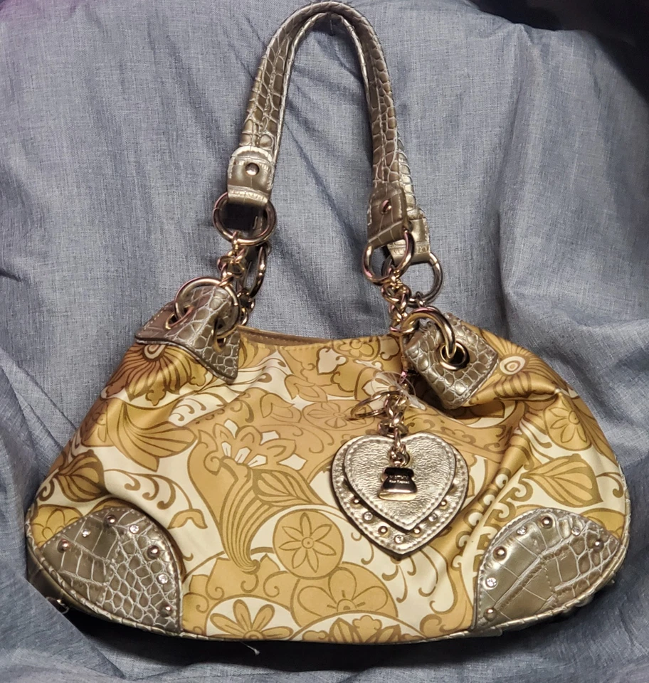 Cartera de diseñador Kathy Van Zeeland. Cierre magnético multibolsillo, con cadena y dijes Foto 1 de 2