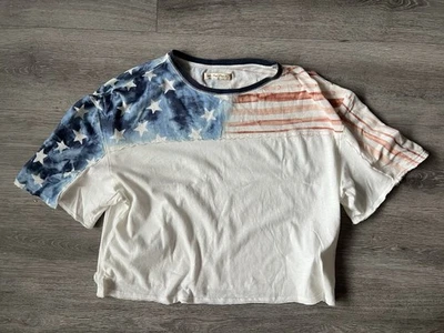 Camiseta branca Free People nova com etiquetas com estrelas azuis e listras vermelhas tamanho G - Imagem 1 de 4