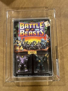 1987 BATTLE BEASTS Sledgehammer Elephant & Roaming Buffalo AFA 80 SERIE 1 NUOVO - Foto 1 di 14
