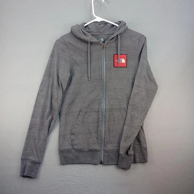Sudadera con Capucha North Face Mujer Gris Mediana Cremallera Completa Ajuste Estándar Nunca Dejes de Explorar Foto 1 de 4