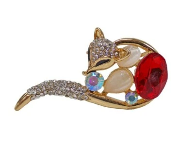 Broche de zorro con cola larga de remolino y un cristal rojo y cristales transparentes en él. Foto 1 de 4