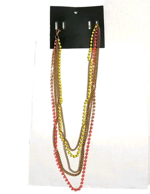 Este artículo es un collar multihiebra tono dorado con cuentas rosa neón y amarillo. Foto 1 de 4