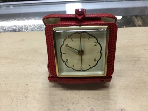 vintage german travel clock/alarm with red leather case- preowned never used Cover