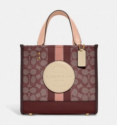 NWT COACH Disney Women’s Dempsey Tote 22 Handbag In Jacquard/Leather Wine C8417 - Image 1 of 4