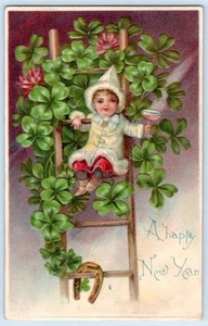 1908 era HAPPY NEW YEAR CHERUB CHAMPAGNE HORSESHOE LADDER SHAMROCKS POSTCARD #1 - Picture 1 of 2