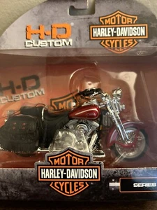 MAISTO FLSTS HERITAGE SPRINGER HARLEY-DAVIDSON 1/18 PRESSOFUSO SERIE 42 1999 - Foto 1 di 6