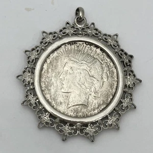 1923 PEACE DOLLAR IN SILVER TONE FILIGREE BEZEL PENDANT - Picture 1 of 3