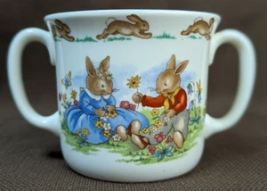 Tazza Bunnykins by Royal Doulton bambino 2 manici abbraccio margherita CATENE fuori produzione - Foto 1 di 9