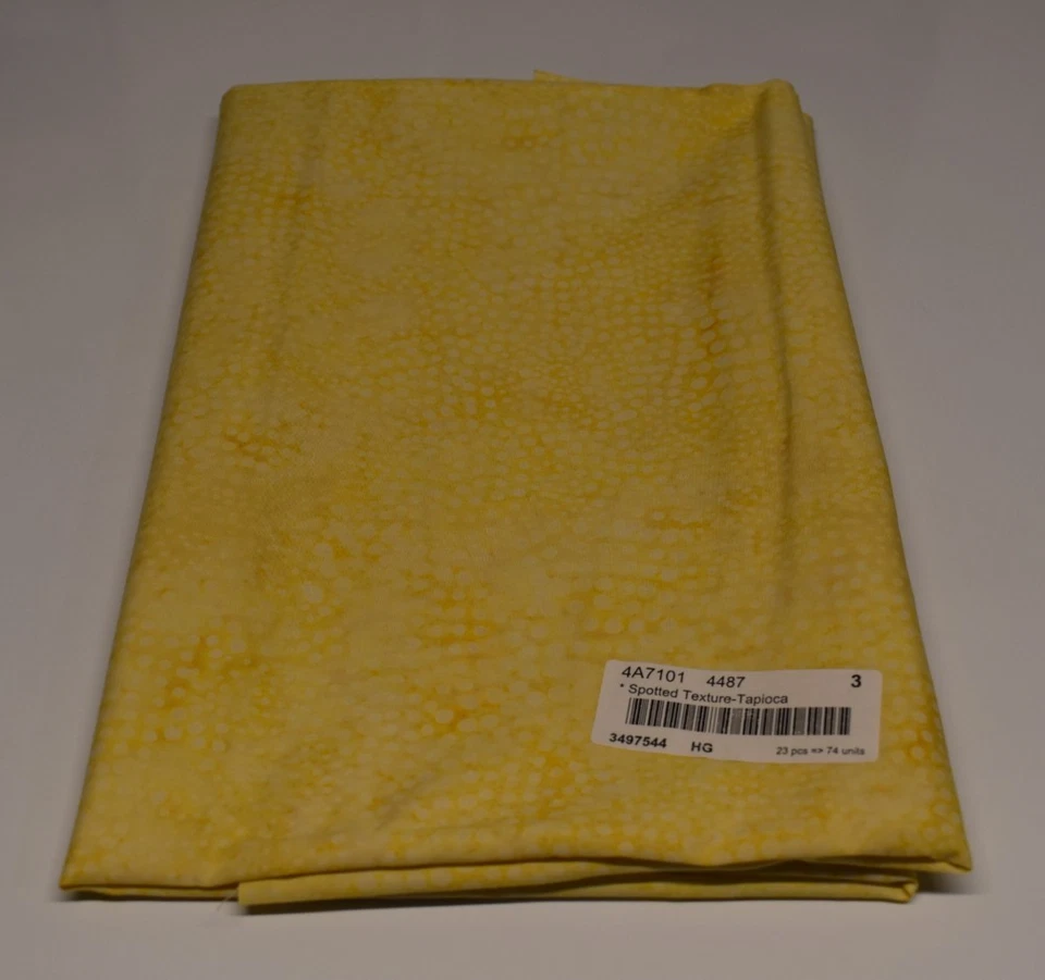 Batik fabric piece SPOTTED TEXTURE TAPIOCA yellow tonal blender ALMOST 3/4 YARD - Image 1 of 2