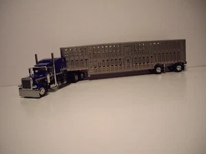DCP FIRST GEAR 1/64 HOUTZEL TRUCKING PETE 389 W/T SLEEPER&SPREAD AXLE LIVESTOCK - Picture 1 of 11