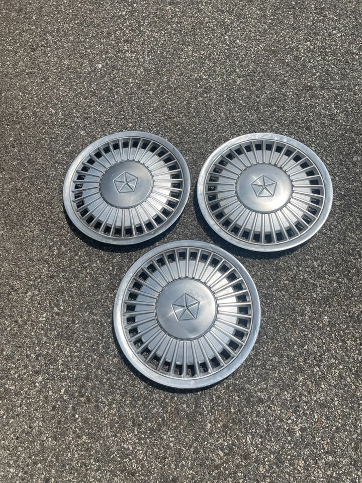 Factory 1984 to 1986 Plymouth Caravelle Voyager LeBaron 14 inch hubcaps - Image 1 of 4