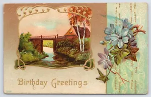 1910 Birthday Country Bridge & Stream Blue Flowers Embossed Gilt Postcard - Picture 1 of 2