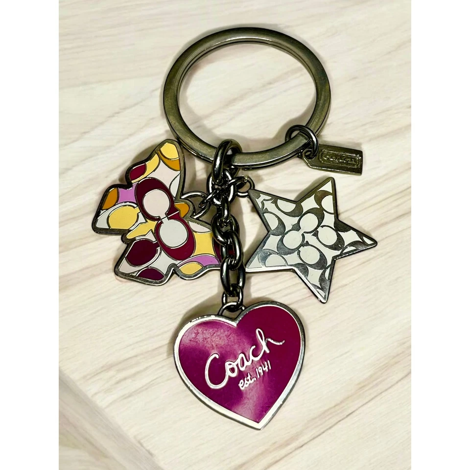 Llavero/bolsa Coach Multi Mix Mariposa encanto  Foto 1 de 3