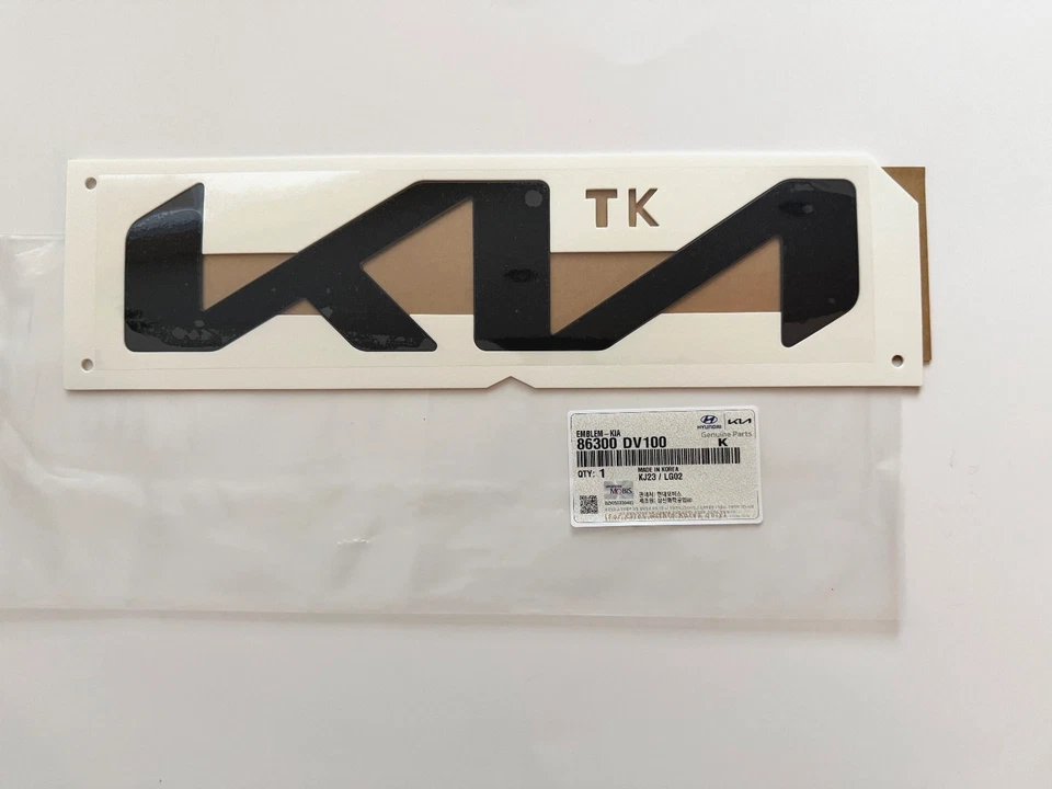 GENUINO OEM EMBLEMA "KIA" delantero negro 86310-DV100 para Kia Tasman 2025-2026 Foto 1 de 1
