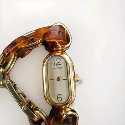 Anne Klein Watch Bracelet Gold Tone Tortoise Band.         (55) - Image 1 of 4
