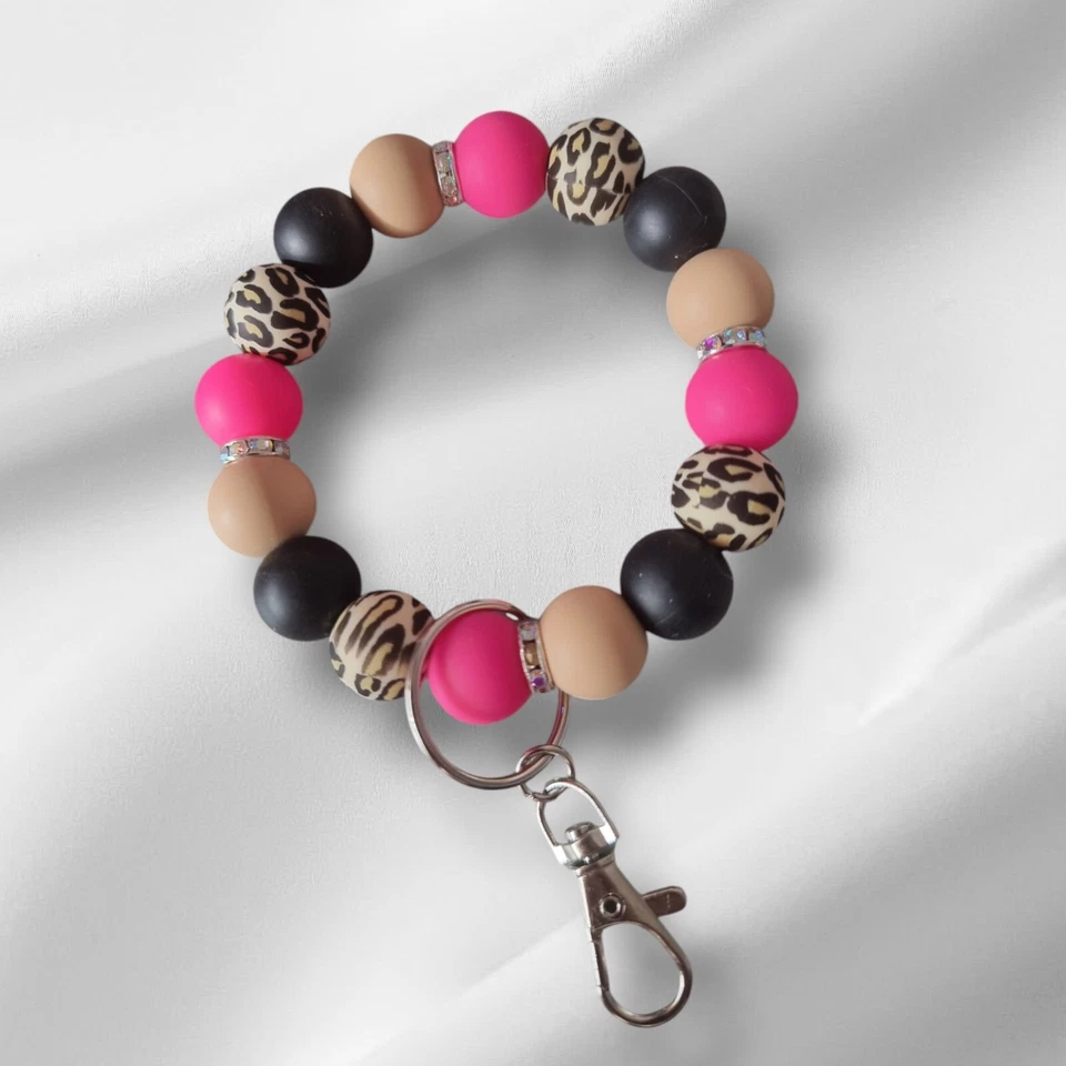 Llavero pulsera con cuentas de silicona negra y estampado de leopardo, rosa intenso Foto 1 de 1