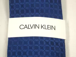 NWT New 100% Silk Calvin Klein Men’s Neck Tie Blue with Circle Pattern Slim - Picture 1 of 5