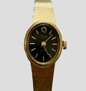 Orologio donna vintage Timex Petite tono oro quadrante nero ovale batteria nuova 5,7" - 6,2" - Foto 1 di 12