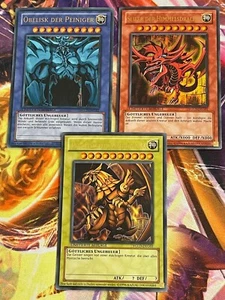 Götterkarten 3er Set Götter YGLD Slifer Obelisk RA Ultra Rare Deutsch NM YUGIOH - Bild 1 von 1