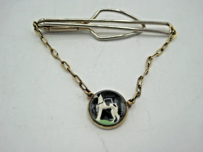 VINTAGE SILVER PLATED TIE CLIP, SUSPENDED REVERSE PAINTED GREYHOUND. - Image 1 of 4