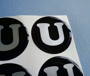 U schwarz 4x Embleme für Nabenkappen Felgendeckel 60mm Silikon Aufkleber U60 2 - Bild 1 von 3