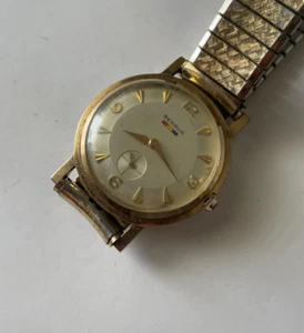 Vintage Benrus Watch 17 Jewels Manual Wind Gold Tone Flag USA Stretch Band - Picture 1 of 3