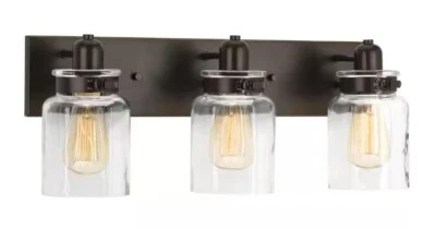 Colección Calhoun 21-5/8 pulgadas Antigua granja urbana de vidrio transparente de bronce antiguo de 3 luces Foto 1 de 3