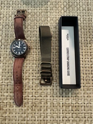 Monstruo de bronce Shinola con cuero original y correas OTAN Foto 1 de 3