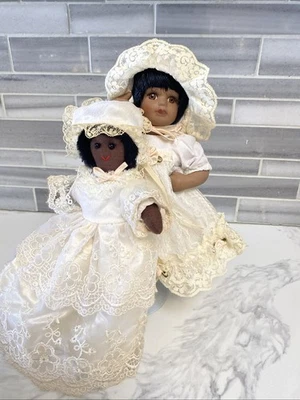 Porcelain Black Baby Doll Carrying Her Litle Cloth doll. 🤎 - Image 1 of 4