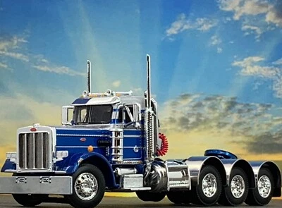 1/64 DCP BLUE/SILVER PETERBILT 359 TRI AXLE DAY CAB - Image 1 of 4