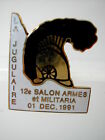 * Pin's Pin La Jugulaire 12 Salon Armes Et Militaria 1 Dec. 1981 Email