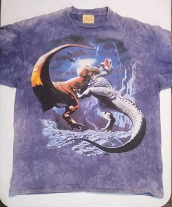 Camiseta Unisex The Mountain Azul Lucha Dinosaurios Cuero Etiqueta XL - Imagen 1 de 5
