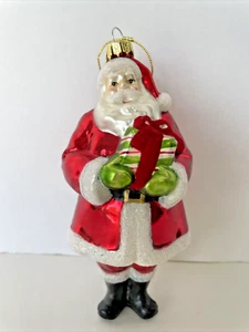 SCF Season of Cannon Falls Glass Ornament Santa with Gift and Glitter 6 1/2" - Picture 1 of 11