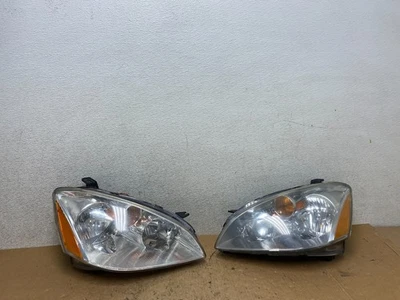 Juego de faros halógenos laterales izquierdo+derecho Nissan Altima 2002 a 2004 OEM Q8184 DW Foto 1 de 4