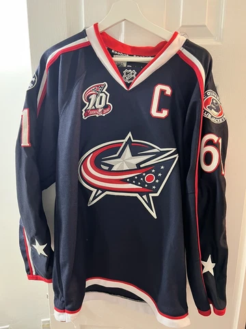 Reebok 2010 RICK NASH No 61 COLUMBUS BLUE JACKETS Size 50 Hockey Jersey w/ Strap Cover