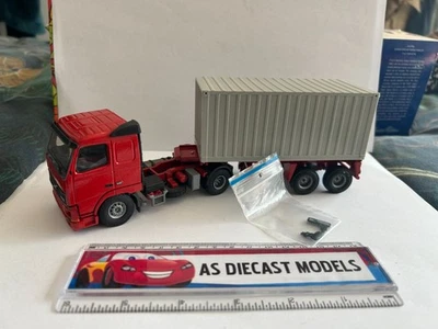 (CB) Tekno Volvo FH rojo liso con remolque esquelético y contenedor 1/50 Foto 1 de 4