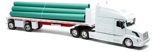 New-Ray 14223 1:32 Volvo VN-780 with Flatbed Trailer with Long Pipes - Picture 1 of 1