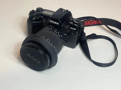 Cámara Sigma SA-300 con lente Sigma Zoom 28-200 LEER NO FUNCIONA piezas reparación Foto 1 de 4