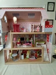 Kinder Puppenhaus aus Holz Kidscraft rosa mit 24 Möbeln, 8 Puppen - Bild 1 von 12