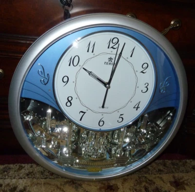 Power Nueva Tendencia Reloj Musical Ciudad Horizonte Telón de Fondo Movimiento Plata Azul Claro Foto 1 de 4