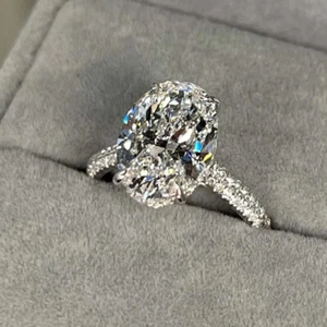 4.99 TCW Oval Cut Moissanite Hidden Halo Engagement Ring 14K White Gold Plated - Picture 1 of 8