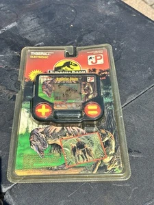 Tiger Electronics Jurassic Park LCD gioco vintage sigillato NOS 1993 - Foto 1 di 3
