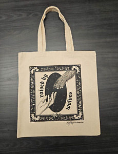 “Raised by Wolves” tote bag