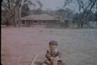35Mm Colour Slide- Small Child Playing With Box In Yard 1950S Usa