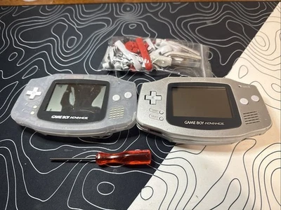 Two Gameboy Advance Shells And Parts ! Silver Has A Good Working Screen ! - Image 1 of 2