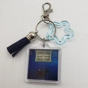 double-sided keychain featuring Billie Eilish's album "HIT ME HARD AND SOFT" - Imagen 1 de 4