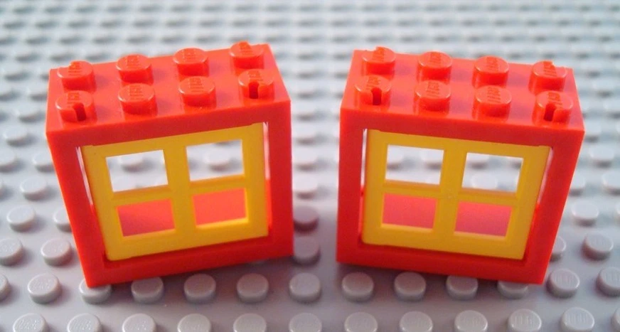 LEGO Lot of 2 Red 2x4x3 Windows with Yellow Panes - Image 1 of 1